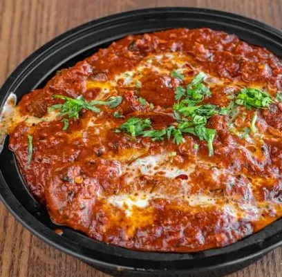 Handmade dumplings in spicy sauce at Dancing Noodle Winnipeg
